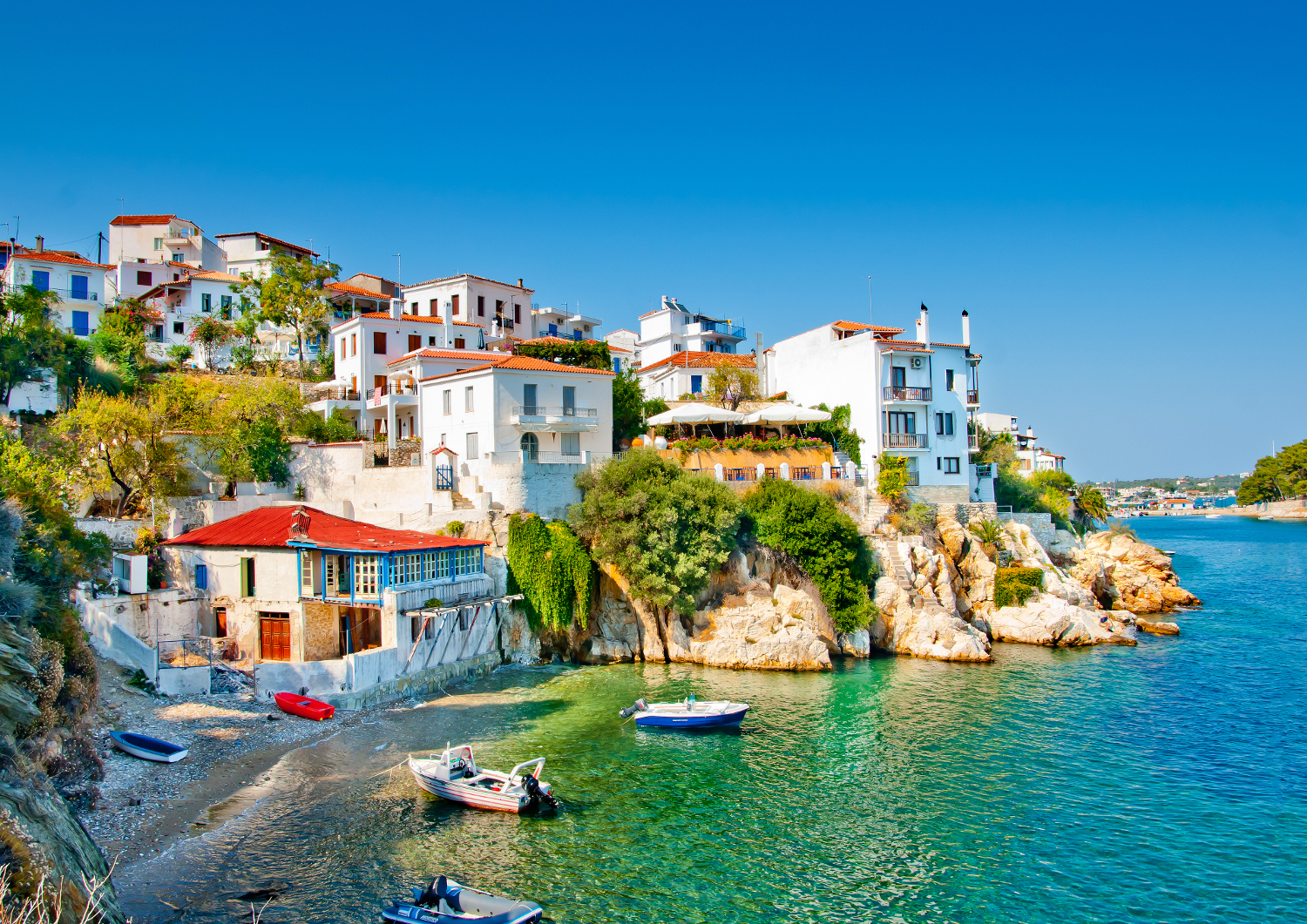 View of the local life and turquoise waters in Skiathos