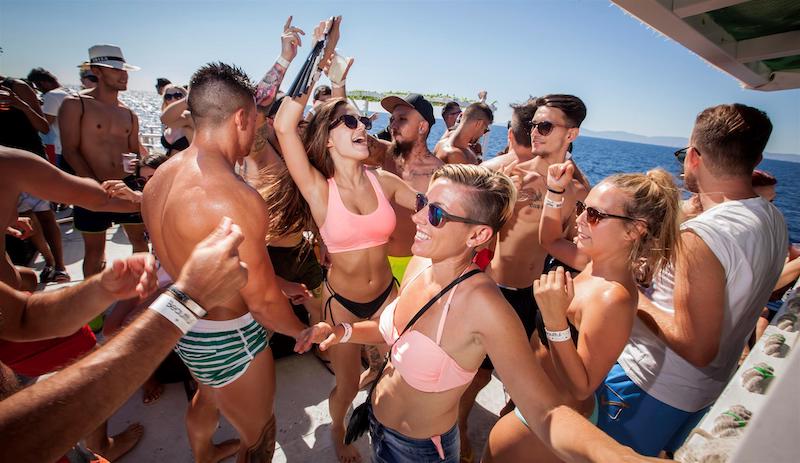picture of a boat party under the sun