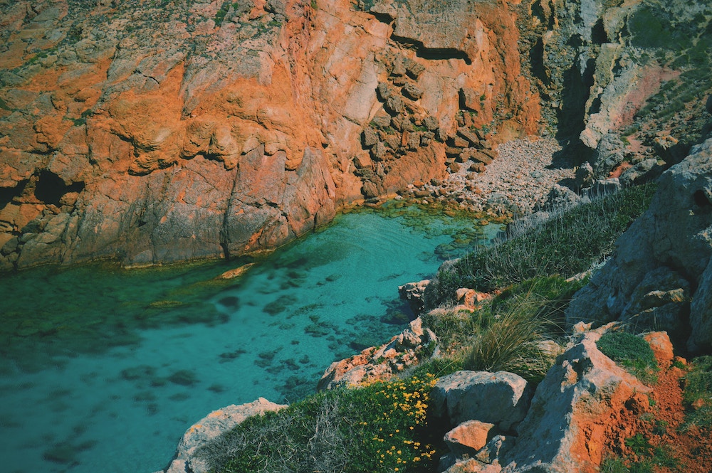 Aerial view of the crystal clear waters and unique landscape in Arenal d'en Castell, Minorca, Spain