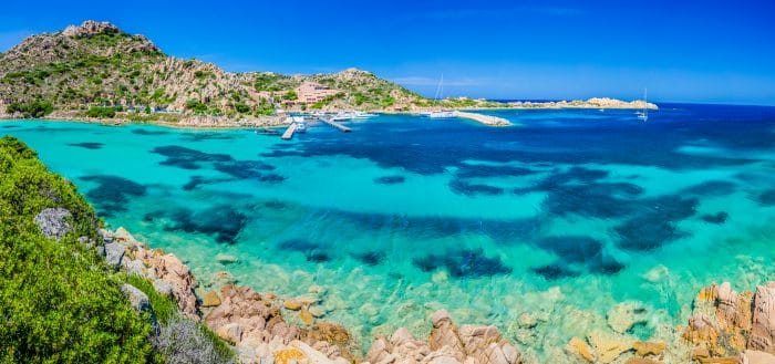Stunning bay in Maddalena with crystal clear water and the surrounding cliffs along the coast