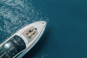 Travelers relaxing aboard a boat anchored in calm waters