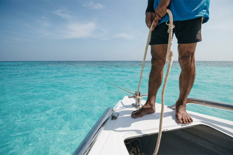 Boat at anchor in turquoise waters