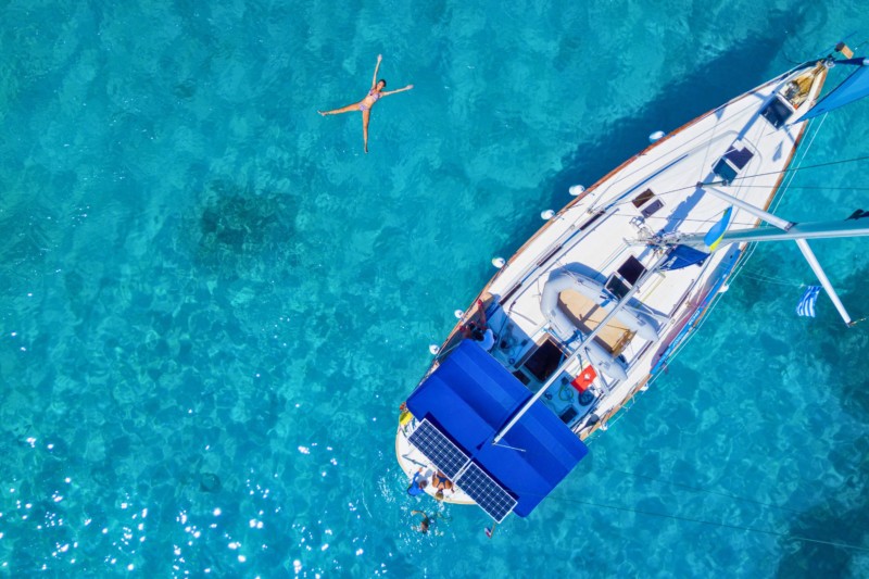 Sailboat anchored in turquoise waters in the Mediterranean
