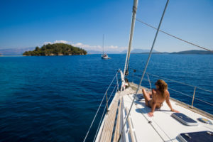 Person on a sailboat in the Mediterranean